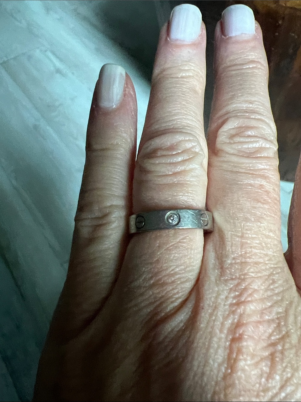 Authentic Cartier Silver Screw-Accent Band Ring with one diamond Center Stone